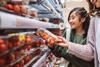strawberries supermarket fruit shopper GettyImages-1457761546