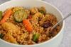 Two bowls of couscous with vegetables