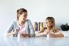 GettyImages_Mother and daughter eating yoghurt_Credit nensuria
