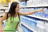 woman reaching for bottled water