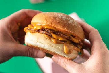 Neat Burger being held portrait
